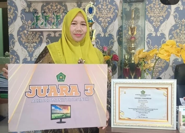 Kepala Madrasah Ibtidaiyah Negeri (MIN) 8 Aceh Besar, Nuraina, S.Pd.I, M.Pd